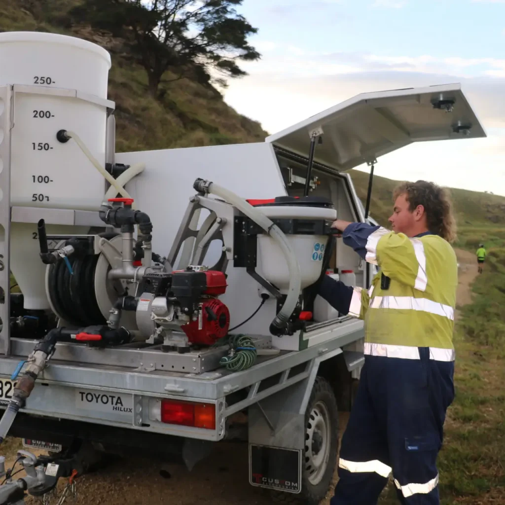 Airborne Solutions team member with Fieldboss Setup on utility vehicle in the field