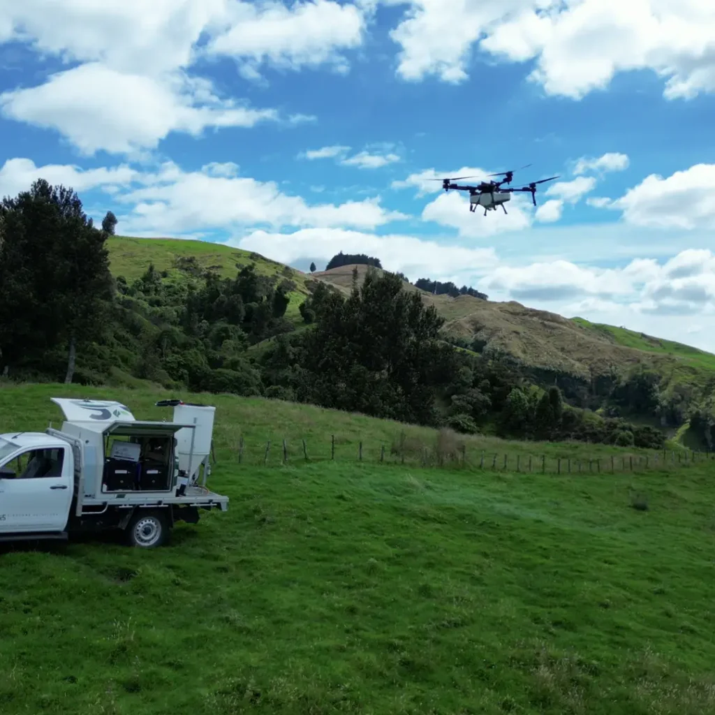 XAG drone hovering above Airborne Solutions vehicle